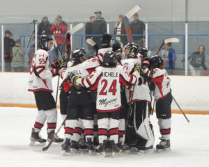 U13 team celebrates win on the ice